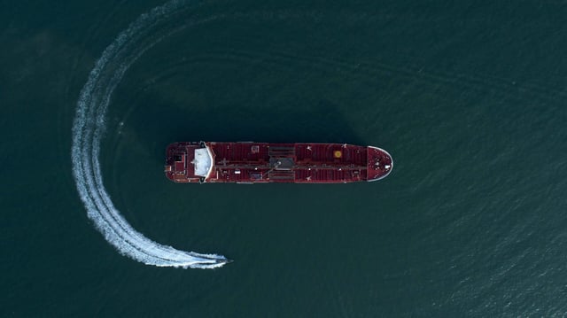  Iranian Revolutionary Guards in speedboats patrolling the British-flagged oil tanker Stena Impero, which was seized in the Strait of Hormuz on Friday by the Guard, in the Iranian port of Bandar Abbas. Global stock markets were subdued Monday while the price of oil climbed as tensions in the Persian Gulf escalated after Iran's seizure of a British oil tanker.  Iran, Persian Gulf, on July 21, 2019. Photo by SalamPix/ABACAPRESS.COM