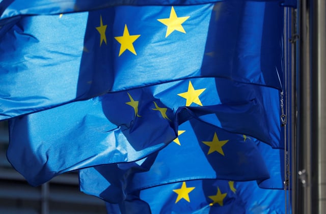 European Union flags are seen outside the EU Commission headquarters in Brussels, prior to a meeting between Britain's Secretary of State for Exiting the EU Dominic Raab and EU's chief Brexit negotiator Michel Barnier, Belgium October 14, 2018. REUTERS/Francois Lenoir