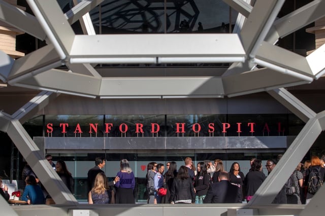 PALO ALTO, CA –  OCT. 23:  Stanford Health Care celebrates the completion of the new Stanford Hospital with a dedication ceremony, Tues. Oct. 23, 2019, in Palo Alto, Calif. Guests enjoy a reception under the “Buckyball” sculpture by Leo Villarreal outside the front entrance. The first patients arrive on Nov. 17. (Karl Mondon/Bay Area News Group)