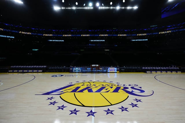 Mar 17, 2025; Los Angeles, California, USA; The Los Angeles Lakers logo at midcourt at Crypto.com Arena. Mandatory Credit: Kirby Lee-Imagn Images
