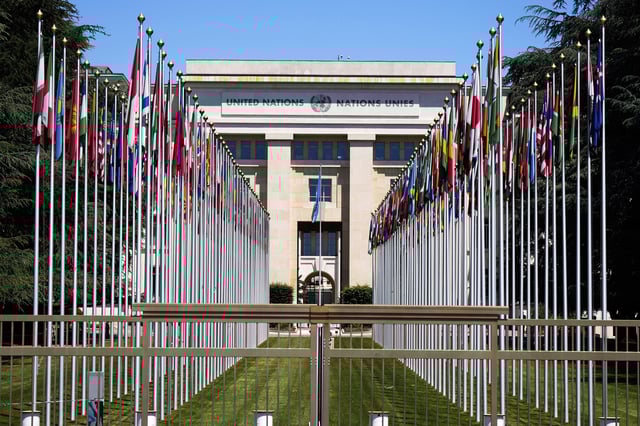 FILE - Flagpoles line in rows in front of a building of the United Nations in Geneva, Switzerland, June 14, 2021. (AP Photo/Markus Schreiber, File)
