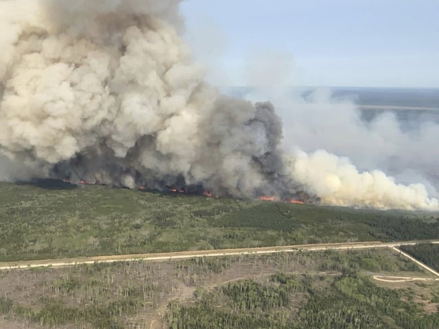 This photo provided by the Manitoba government shows wildfires in Wanless, Manitoba, Canada, on Tuesday, May 27, 2025. (Manitoba government via AP)