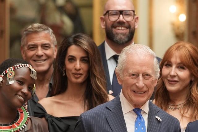 King Charles III poses for a group photo with George and Amal Clooney and other stars as well as winners of the King&#39;s Trust Awards 2025 during a reception at Buckingham Palace on June 25, 2025.