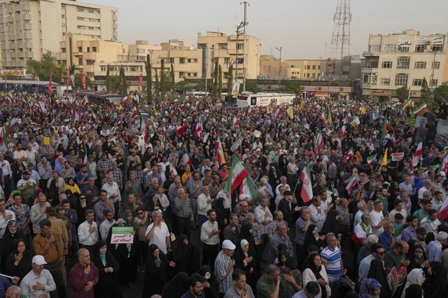 Iranian protesters attend an anti-U.S. and anti-Israeli rally at Enqelab-e-Eslami (Islamic Revolution) square in downtown Tehran, Iran, Tuesday, June 24, 2025. (AP Photo/Vahid Salemi)