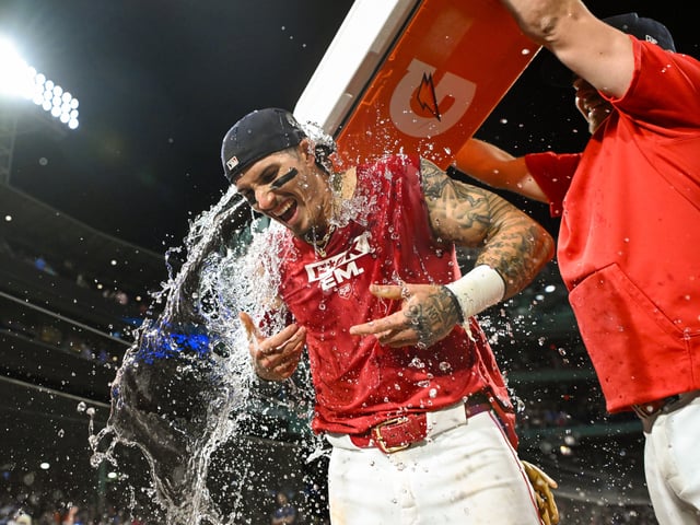BOSTON, MASSACHUSETTS - JUNE 24: Jarren Duran #16 of the Boston Red Sox is doused with water after hitting the game winning RBI against the Toronto Blue Jays during the ninth inning at Fenway Park on June 24, 2024 in Boston, Massachusetts.