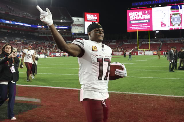 Terry McLaurin #17 of the Washington Commanders celebrates after an NFL football wild card playoff game against the Tampa Bay Buccaneers at Raymond James Stadium on January 12, 2025 in Tampa, Florida.