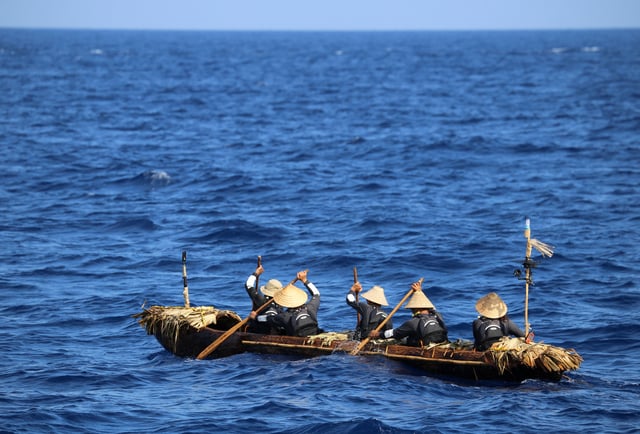 A dugout canoe with four men and one woman paddling is pictured during a crossing across a region of the East China Sea from near Ushibi, Taiwan to Yonaguni Island, traversing the Kuroshio current, in this handout image released on June 25, 2025. Yousuke Kaifu/Handout via REUTERS