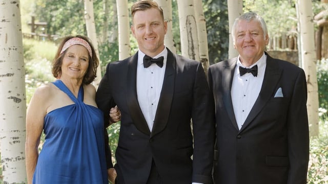 This undated photo provided by the Pickles family shows Josh Pickles, center, with his parents Terry Pickles, right, and mother Paula Bozinovich. (Pickles Family via AP)