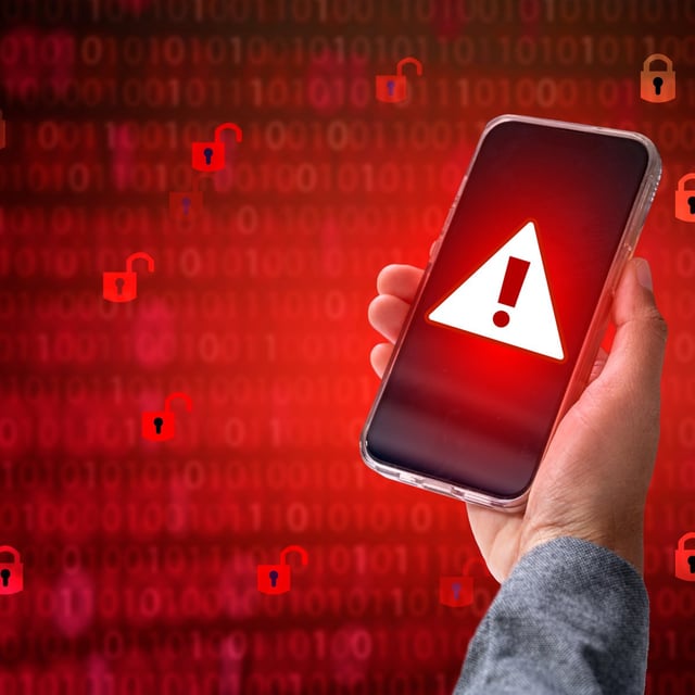 Hacker in a blue hoody standing in front of a coding background with binary streams and information security terms cybersecurity concept