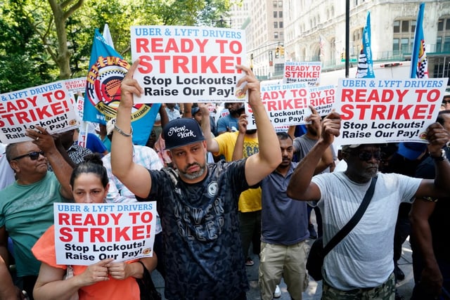 Uber and Lyft drivers protest low wages and being locked out of their respective apps outside New York City Hall on Wednesday, July 17, 2024, in Manhattan, New York. (Barry Williams for New York Daily News)