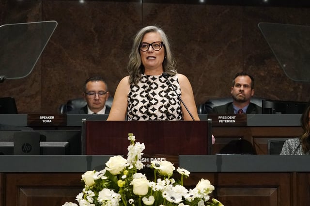 FILE - Arizona Democratic Gov. Katie Hobbs, center, delivers the State of the State address at the state Capitol as she is flanked by Speaker of the House Ben Toma, left, R-Glendale, and President of the Senate Warren Petersen, R-Gilbert, Jan. 8, 2024, in Phoenix. (AP Photo/Ross D. Franklin, File)
