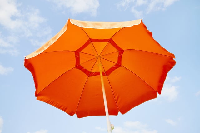 The incident happened around 9:30 a.m. as the woman was setting up her umbrella for the day.