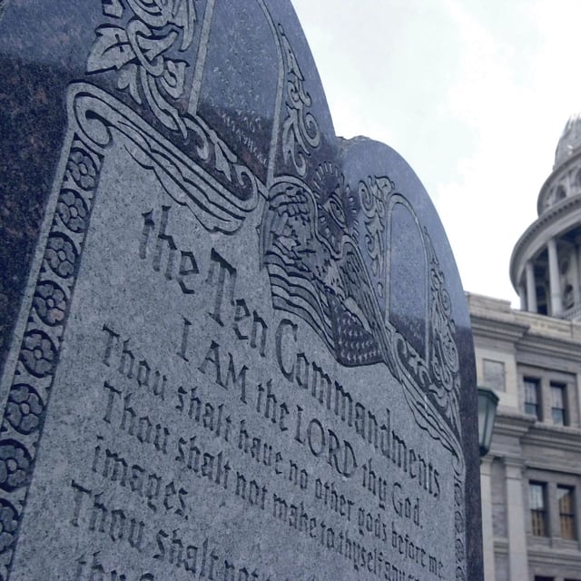 A stone slab bearing the Ten Commandments near the Capitol in Austin, Texas. Texas Republican Governor Greg Abbott signed a  measure into law on June 21 to require public schools to display the Ten Commandments.