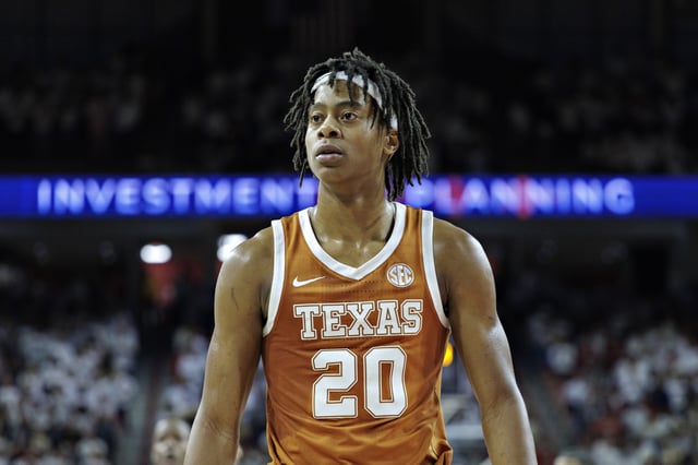 Tre Johnson #20 of the Texas Longhorns on the court during a game against the Arkansas Razorbacks at Bud Walton Arena on February 26, 2025 in Fayetteville, Arkansas. The Razorbacks defeated the Longhorns in overtime 86-81.