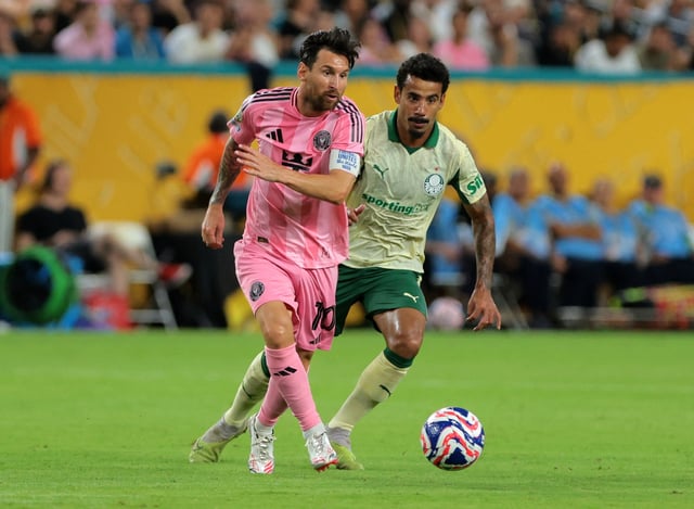 Soccer Football - FIFA Club World Cup - Group A - Inter Miami CF v Palmeiras - Hard Rock Stadium, Miami Gardens, Florida, U.S. - June 23, 2025 Inter Miami CF's Lionel Messi in action with Palmeiras' Lucas Evangelista IMAGN IMAGES via Reuters/Sam Navarro