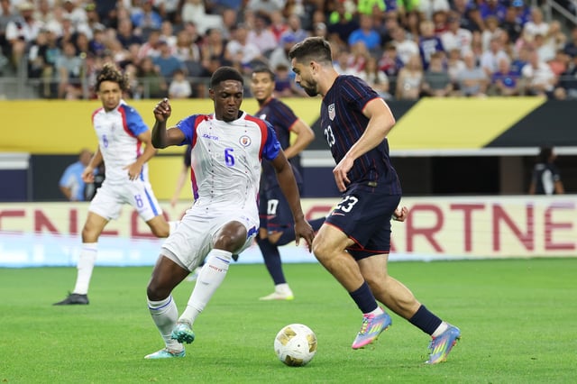 Jun 22, 2025; Arlington, Texas, USA; United States of America forward Brian White (23) and Haiti defender Garven-Michee Metusala (6) battle for the ball in the second half during a group stage match of the 2025 Gold Cup at AT&T Stadium. Mandatory Credit: Kevin Jairaj-Imagn Images