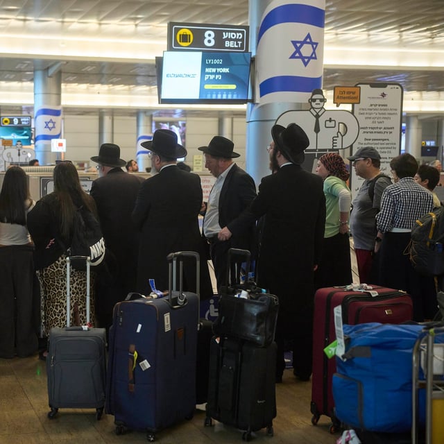 Travellers at Ben Gurion Airport a day after the announcement of a ceasefire between Israel and Iran, near Tel Aviv on Wednesday.