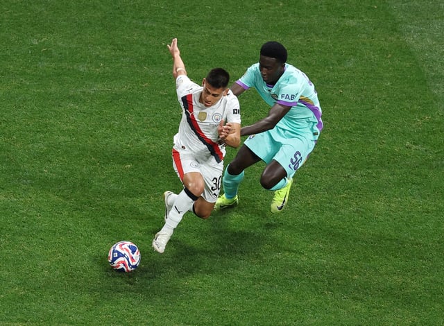 Soccer Football - FIFA Club World Cup - Group G - Manchester City v Al Ain - Mercedes-Benz Stadium, Atlanta, Georgia, U.S. - June 22, 2025 Manchester City's Claudio Echeverri in action with Al Ain's Amadou Niang REUTERS/Amanda Perobelli