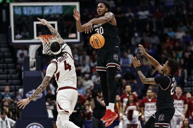 South Carolina forward Collin Murray-Boyles (30) defends against Arkansas forward Trevon Brazile (4) during the second half of an NCAA college basketball game at the Southeastern Conference tournament, Wednesday, March 12, 2025, in Nashville, Tenn. (AP Photo/Wade Payne)