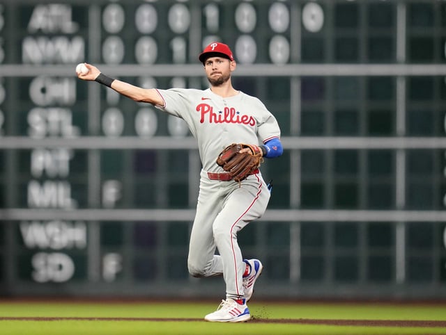 Philadelphia Phillies shortstop Trea Turner (7) makes the throw to first base as Houston Astros&#39; Christian Walker ground out during the fourth inning of a baseball game, Wednesday, June 25, 2025, in Houston. (AP Photo/Karen Warren)