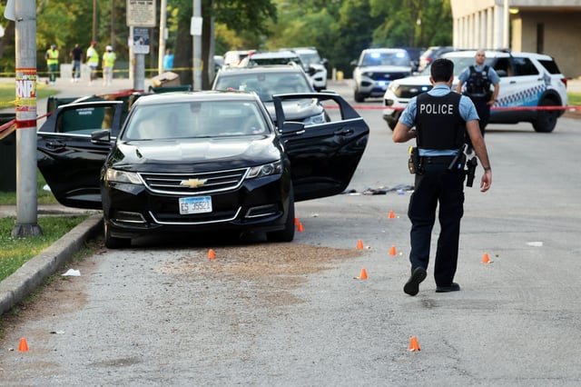Chicago Police process a crime scene in Ogden Park off of S. Racine Avenue in Chicago after several people were shot and wounded there on Wednesday, June 25, 2025. (Terrence Antonio James/Chicago Tribune)
