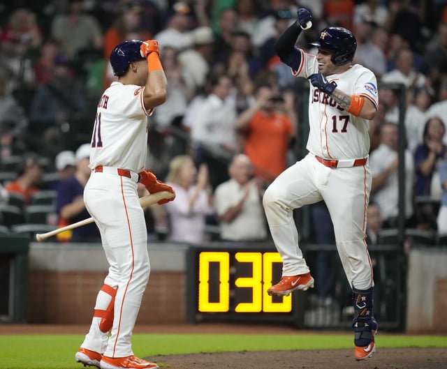Houston Astros&#39; Victor Caratini (17) celebrates with Cam Smith (11) after hitting a home run against Philadelphia Phillies relief pitcher Matt Strahm during the eighth inning of a baseball game, Wednesday, June 25, 2025, in Houston. (AP Photo/Karen Warren)
