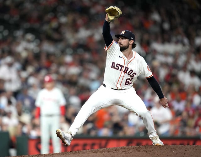 Houston Astros relief pitcher Bennett Sousa (62) pitches to Philadelphia Phillies&#39; Edmundo Sosa during the seventh inning of a baseball game, Wednesday, June 25, 2025, in Houston. (AP Photo/Karen Warren)