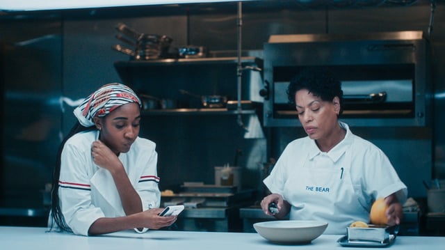 Ayo Edebiri as Sydney Adamu and Liza Colón-Zayas as Tina in "The Bear" Season 4.