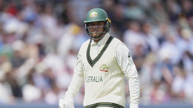 Australia's Usman Khawaja walks off the field