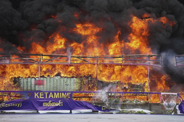 Smoke and flame rise from burning illegal narcotics during a destruction ceremony to mark International Day against Drug Abuse and Illicit Trafficking, on the outskirts of Yangon, Myanmar, Thursday, June 26, 2025. (AP Photo/Thein Zaw)