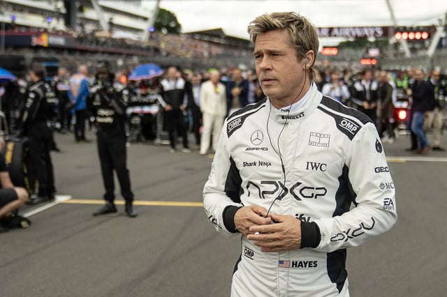 Formula One driver Sonny Hayes (Brad Pitt) suits up to help a friend in “F1: The Movie.”