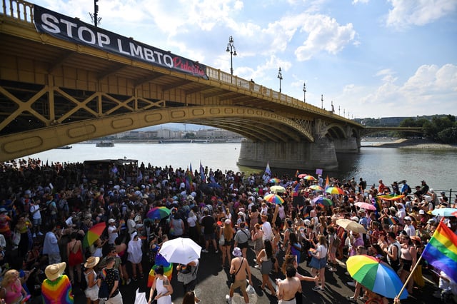 A view shows a banner reading "STOP LMBTQ" hanging from a bridge as people attend the Budapest Pride march in Budapest, Hungary, July 23, 2022. REUTERS/Marton Monus/File Photo