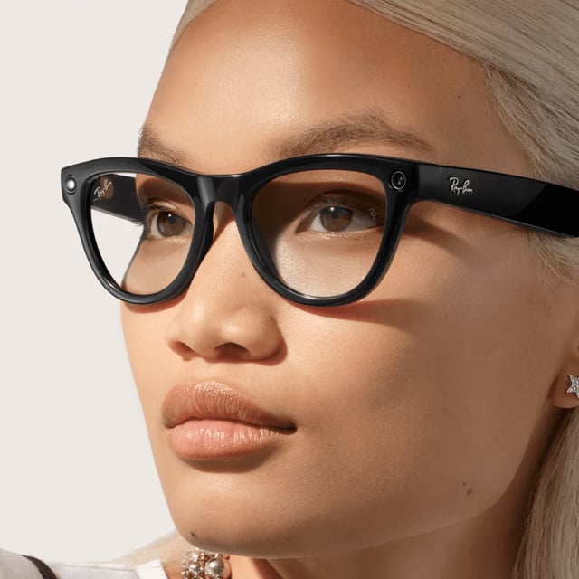 A woman wearing Ray-Ban Meta smart glasses.