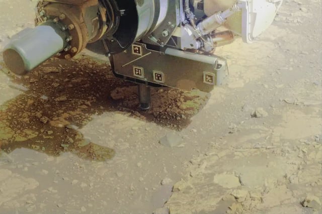NASA’s Perseverance rover uses an abrading bit to get below the surface of a rocky out-crop nicknamed “Kenmore” on June 10. The eight images that make up this video were taken approximately one minute apart by one of the rover’s front hazard-avoidance cameras. NASA/JPL-Caltech