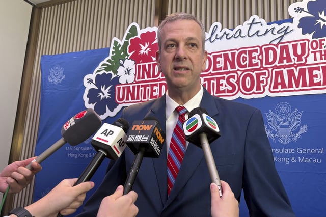 U.S. Consul General in Hong Kong Gregory May speaks to reporters at the Independence Day Reception on Thursday, June 26, 2025. (AP Photo/Kanis Leung)