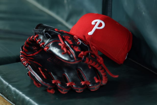 ATLANTA, GEORGIA - APRIL 08: A detailed view of the hat and glove of Bryson Stott #5 of the Philadelphia Phillies in the seventh inning against the Atlanta Braves at Truist Park on April 08, 2025 in Atlanta, Georgia.