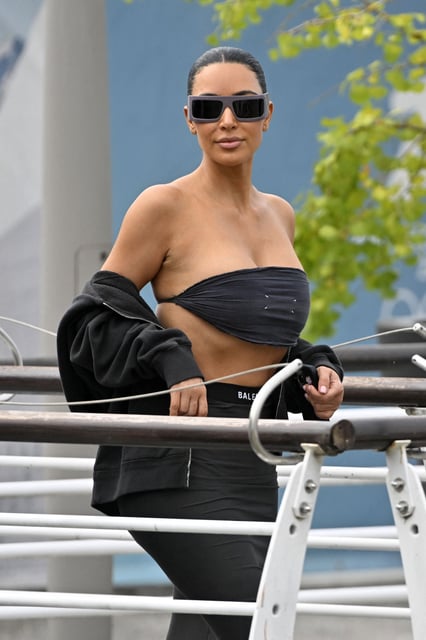 US reality TV personalities Kim Kardashian walks to board a taxi boat at Venice Marco Polo airport ahead of Jeff Bezos' wedding on June 26, 2025. Celebrities in superyachts sail into Venice this week for the three-day wedding party of Amazon tycoon Jeff Bezos and Lauren Sanchez, despite irate locals who say the UNESCO city is no billionaire's playground. The tech magnate and journalist have reportedly invited about 200 guests to their multi-million dollar nuptials in the Italian city, which are expected to kick off on June 26 and end Saturday with a ceremony at a secret location. (Photo by ANDREA PATTARO / AFP) (Photo by ANDREA PATTARO/AFP via Getty Images)          