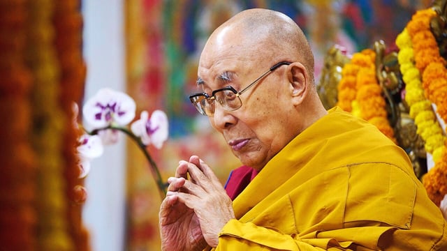The Dalai Lama prays at an event at the Tsuglakhang temple in Dharamshala, India.