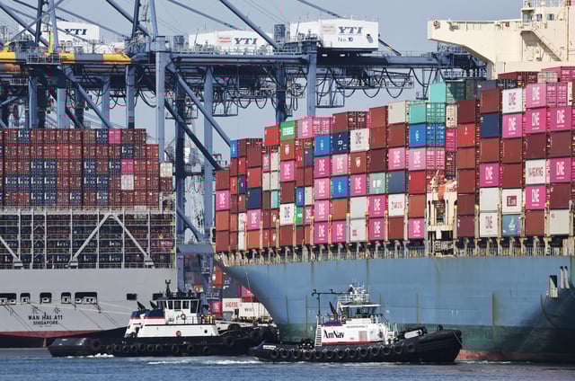 Shipping containers are stacked on container ships at the Port of Los Angeles on June 25, 2025 in Los Angeles, California.