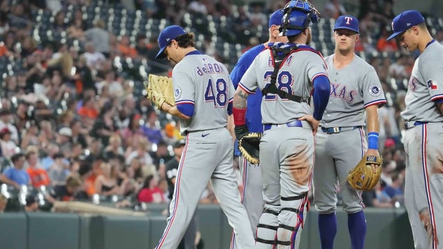 Texas Rangers pitcher Jason deGrom (48) exits the game in the eighth inning against the Baltimore Orioles at Oriole Park at Camden Yards.