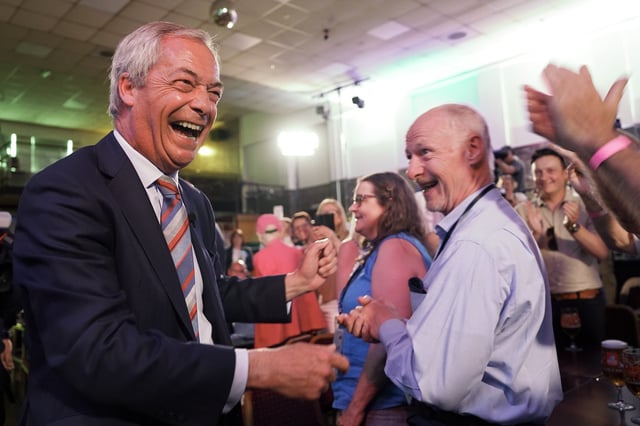 DURHAM, ENGLAND - MAY 02: Reform UK party leader Nigel Farage is seen celebrating with supporters after Reform UK took control of Durham County Council after winning more than half of the seats on May 02, 2025 in Durham, England. The Reform Party won the Runcorn by-election by a slim margin of six votes, taking the safe seat from Labour. They are picking up council seats across England from the Conservatives and Labour, and have installed a new Mayor in Greater Lincolnshire in last night&#39;s local elections. (Photo by Ian Forsyth/Getty Images)