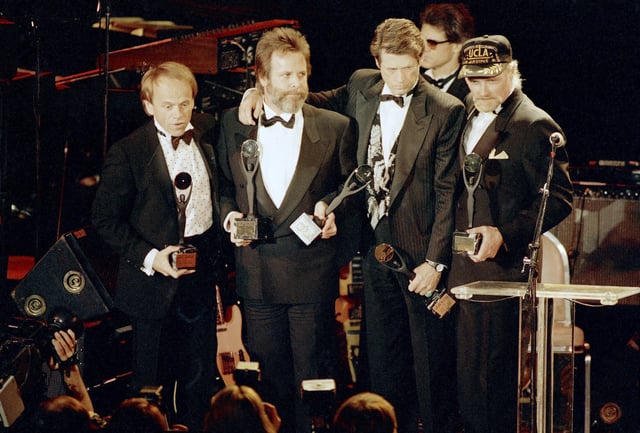 FILE - The Beach Boys, from left, Al Jardine, Carl Wilson, Brian Wilson and Mike Love, hold their trophies after being inducted into the Rock 'n' Roll Hall of Fame in New York, Jan. 21, 1988. (AP Photo/Ron Frehm, File)
