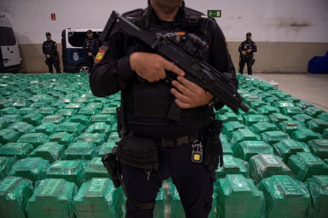 This image from November 6, 2024 shows Spanish police and customs officers in Algeciras, Spain, next to seized cocaine found in a container from Ecuador.