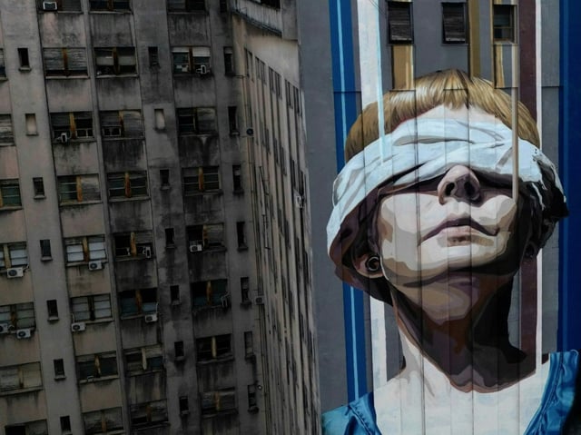 A Buenos Aires mural in honor of the 85 dead and more than 300 wounded in an 1994 attack on the Jewish community center of the Mutual Israelite Association of Argentina (AMIA)