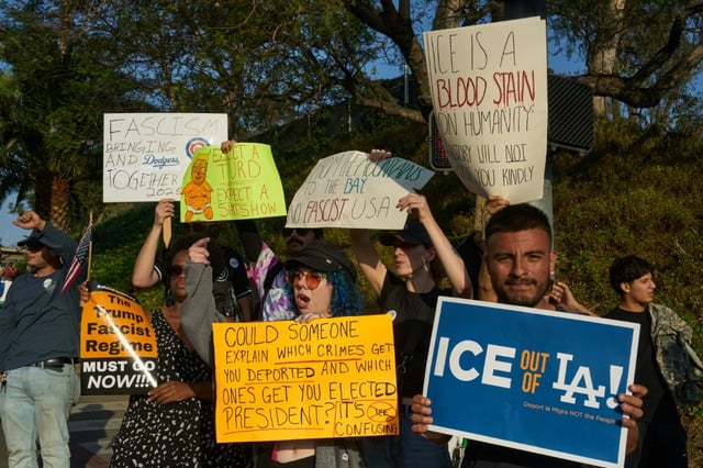 Protestors at a game day demonstration against the Los Angeles Dodgers organization and ICE immigration raids outside Dodger Stadium in Los Angeles, California