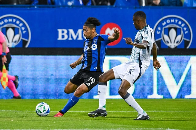 May 31, 2025; Montreal, Province of Quebec, CAN; CF Montreal midfielder Nathan Saliba (19) shoots the ball against New England Revolution midfielder Mamadou Fofana (2) during the first half at Saputo Stadium. Mandatory Credit: David Kirouac-Imagn Images/File Photo