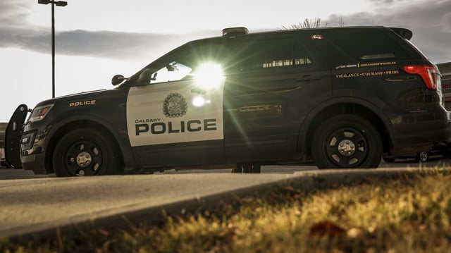Calgary Police Service attend the scene where a colleague was shot and injured and a suspect was killed in Calgary, Wednesday, Oct. 18, 2023. THE CANADIAN PRESS/Jeff McIntosh