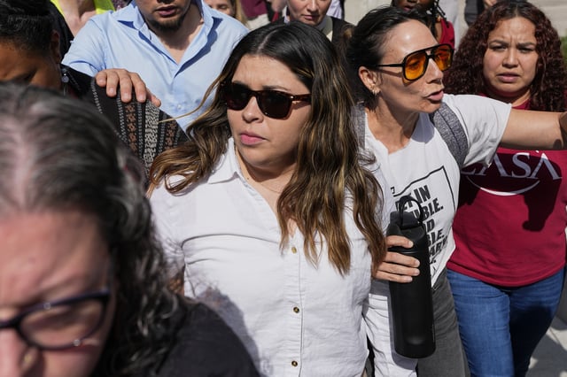 Jennifer Vasquez Sura, center left, wife of Kilmar Abrego Garcia leaves the federal courthouse Wednesday, June 25, 2025, in Nashville, Tenn. (AP Photo/George Walker IV)