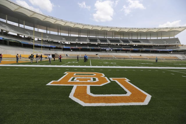 The Baylor University logo is displayed on the football field at McLane Stadium in Waco in this file photo.