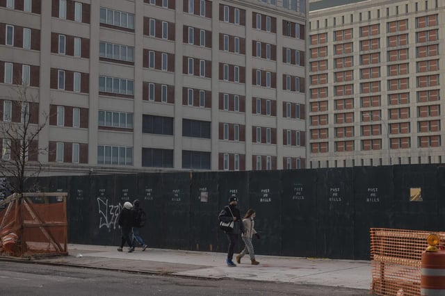 People walk past the Metropolitan Detention Center in Brooklyn in 2021.